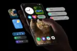 Hand holding a smartphone displaying a cat wallpaper with floating widgets for clock, weather, steps, and messages around it.