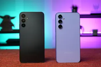 Two Samsung smartphones shown from the back on a red surface, black and lavender finishes with multiple rear cameras and a neon backdrop.