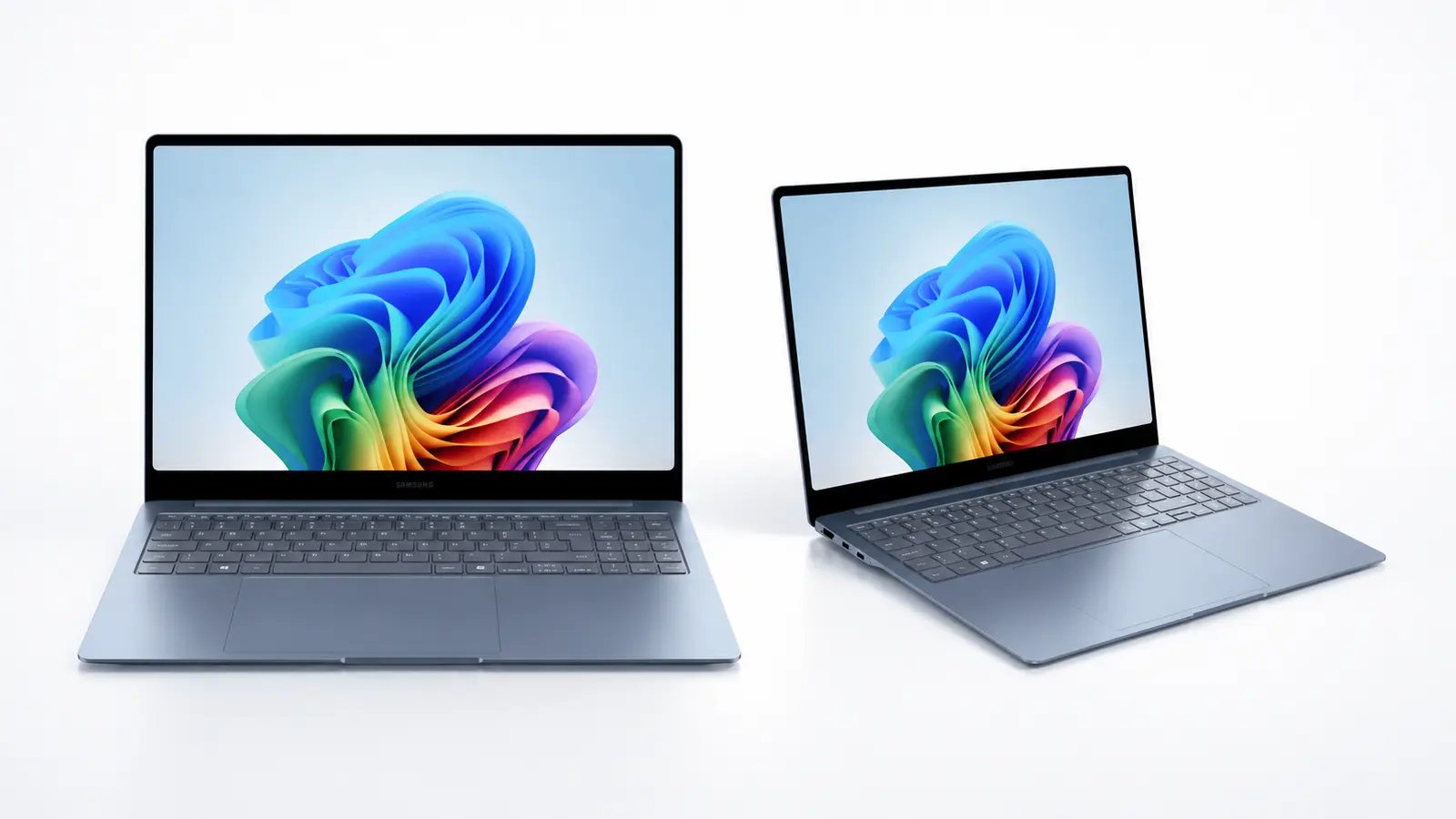 Two slim laptops open on a white surface, displaying a vibrant abstract wallpaper on their screens.