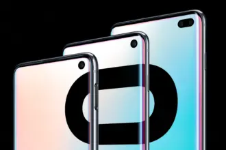 Three sleek smartphones arranged diagonally, showing edge-to-edge screens and glossy rounded backs against a black background.