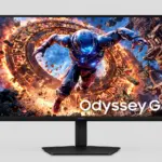Samsung Odyssey G8 gaming monitor displaying a sci-fi character surrounded by fiery rings; bold, cinematic wallpaper on screen